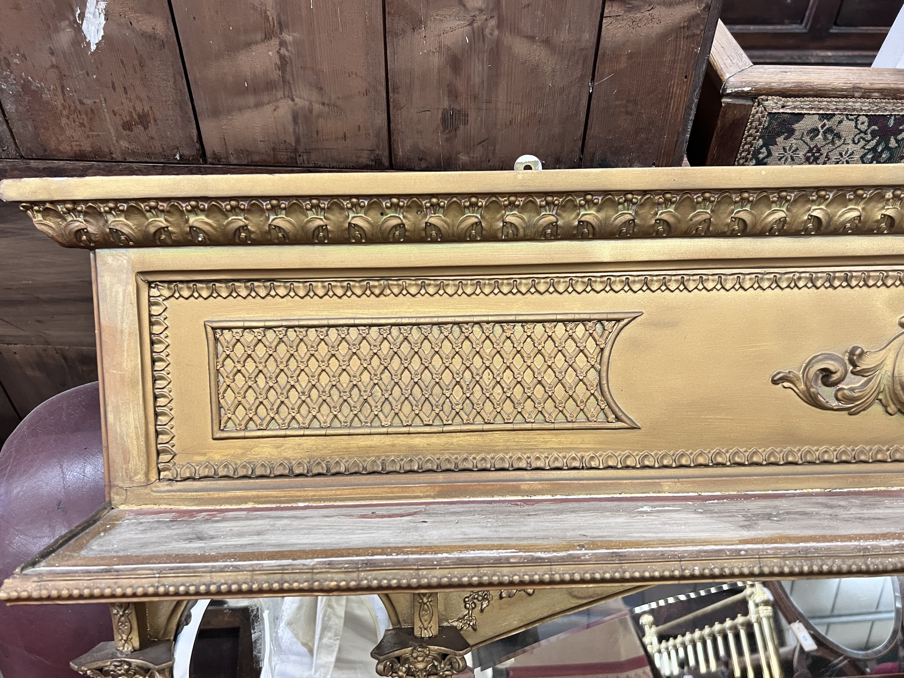 A late Victorian giltwood and composition triple plate overmantel mirror, width 144cm, height 85cm